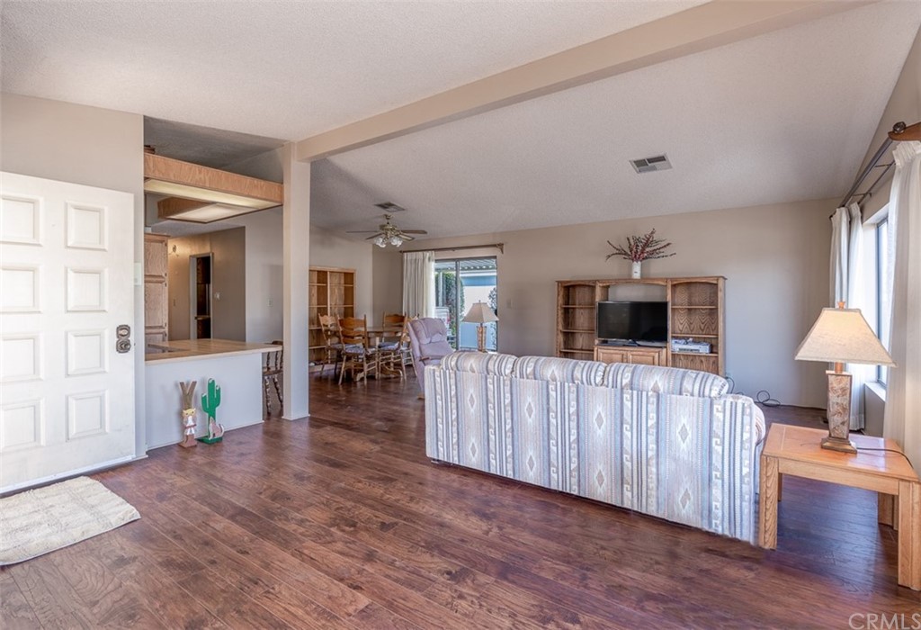 24600 Mountain Avenue, Unit 57 Hemet, CA 92544 - Photo 5 of 20 a living room with furniture and a wooden floor