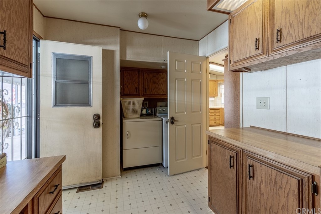 24600 Mountain Avenue, Unit 57 Hemet, CA 92544 - Photo 9 of 20 a view of kitchen with refrigerator cabinets and furniture