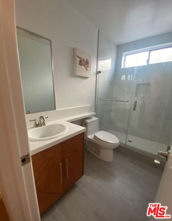 1940 North Highland Avenue, Unit 44 Los Angeles, CA 90068 - Photo 7 of 10 a bathroom with a sink a toilet and shower