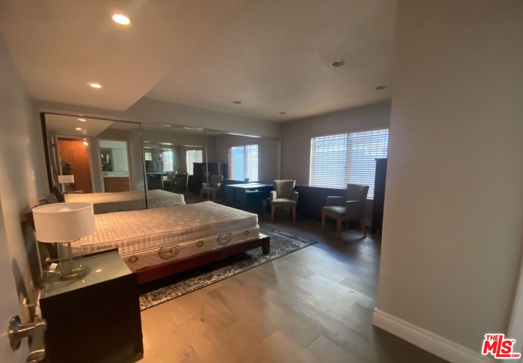 1940 North Highland Avenue, Unit 44 Los Angeles, CA 90068 - Photo 9 of 10 a living room with furniture and a wooden floor