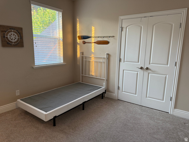 2388 East 850 South Springville, UT 84663 - Photo 21 of 24 Wall-to-wall carpeting, window with horizontal blinds, and a double-door closet with arch-top panels