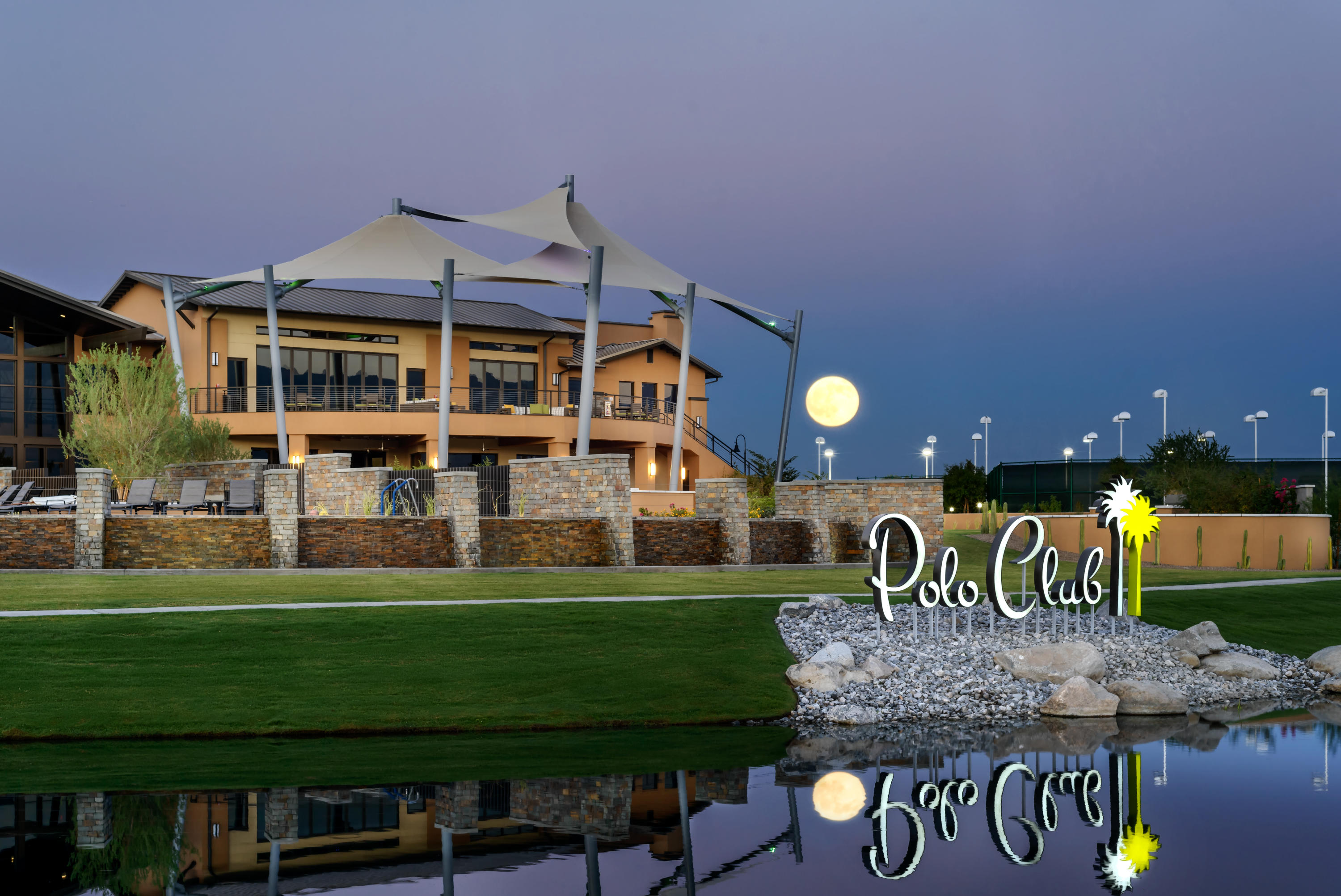 50820 Bee Canyon Indio, CA 92201 - Photo 2 of 11 a front view of a house with a big yard and a garden