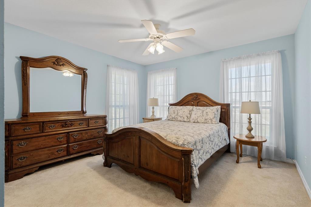 271 VZ County Road Canton, TX 75103 - Photo 27 of 40 a bedroom with a bed and a dresser