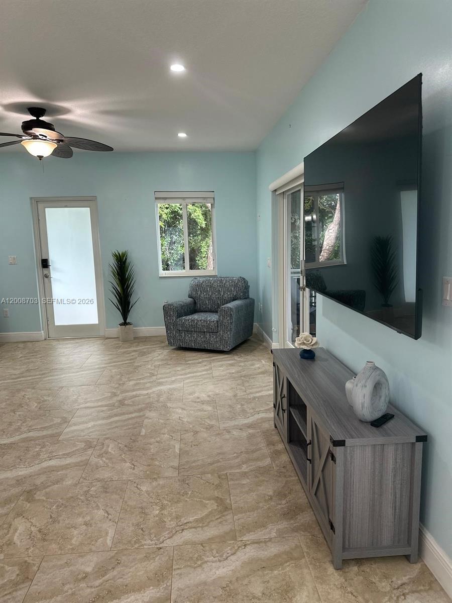 1019 Snapper Lane Key Largo, FL 33037 - Photo 17 of 37 a living room with furniture and a flat screen tv