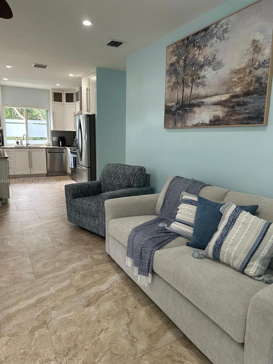 1019 Snapper Lane Key Largo, FL 33037 - Photo 22 of 37 a living room with a couch