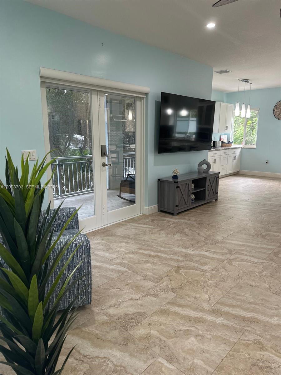 1019 Snapper Lane Key Largo, FL 33037 - Photo 23 of 37 a living room with furniture and a flat screen tv