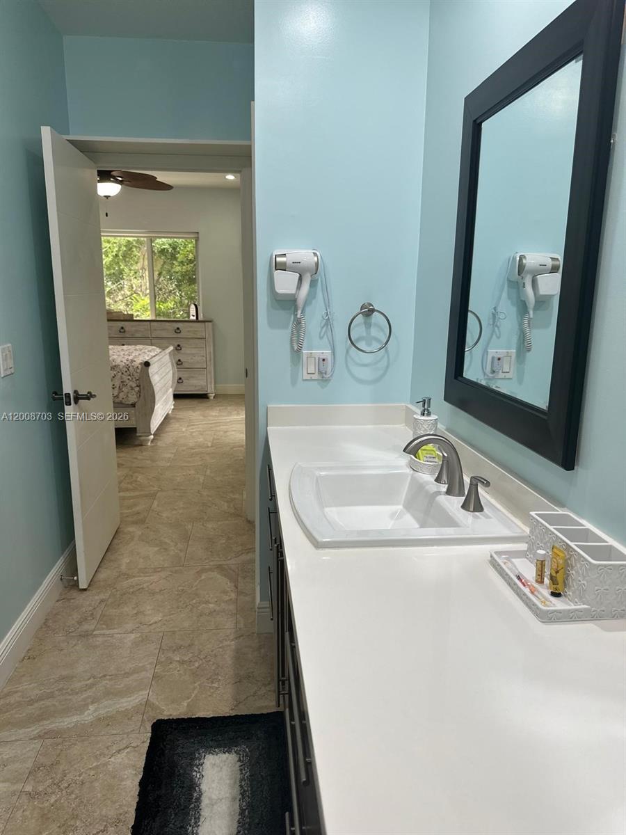1019 Snapper Lane Key Largo, FL 33037 - Photo 28 of 37 a bathroom with a sink and a mirror