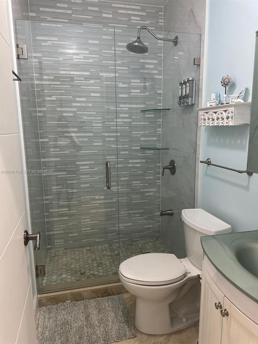 1019 Snapper Lane Key Largo, FL 33037 - Photo 30 of 37 a white toilet sitting next to a shower