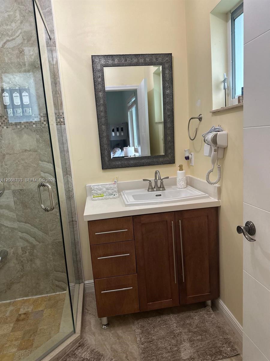 1019 Snapper Lane Key Largo, FL 33037 - Photo 34 of 37 a bathroom with a sink vanity and a mirror