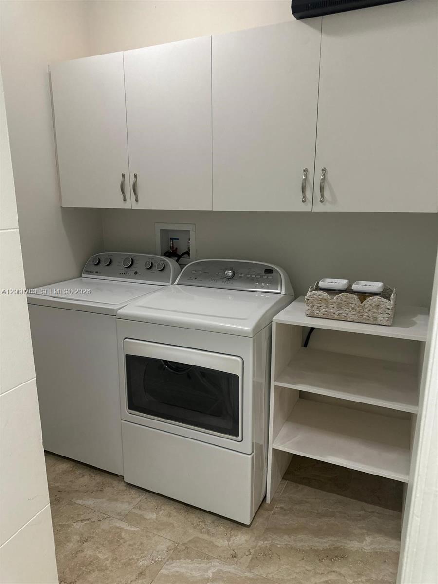 1019 Snapper Lane Key Largo, FL 33037 - Photo 35 of 37 a utility room with dryer and washer