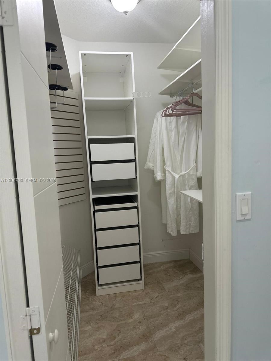 1019 Snapper Lane Key Largo, FL 33037 - Photo 37 of 37 a view of walk in closet with empty racks