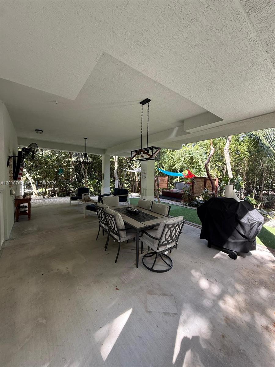 1019 Snapper Lane Key Largo, FL 33037 - Photo 5 of 37 a living room with furniture and a large window