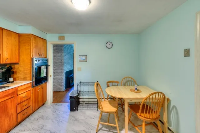 a dining room with furniture and windows
