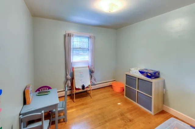 a room with furniture and wooden floor