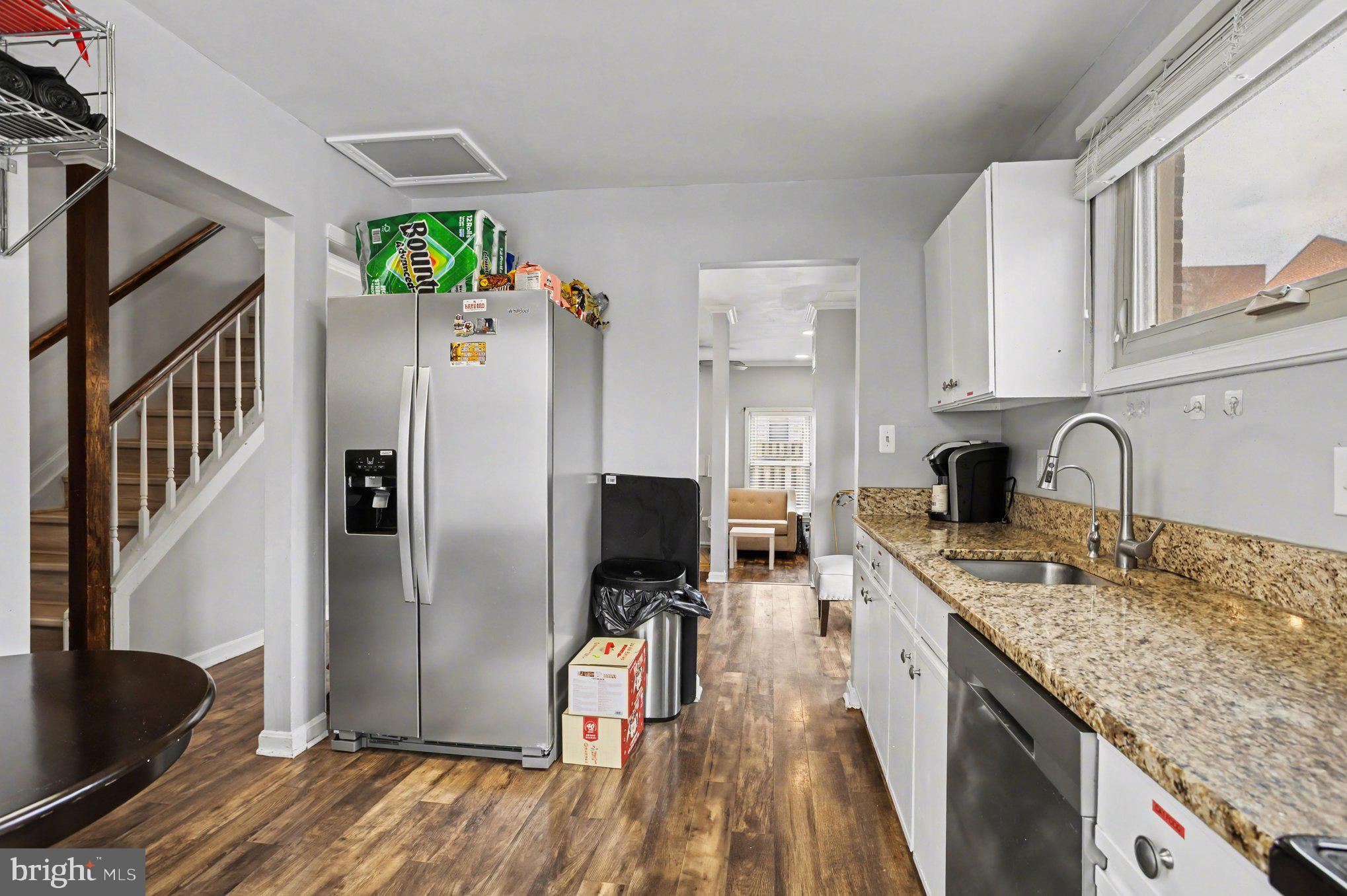 216 Scott Street Baltimore, MD 21230 - Photo 11 of 27 a kitchen with stainless steel appliances granite countertop a refrigerator a sink a stove and dishwasher