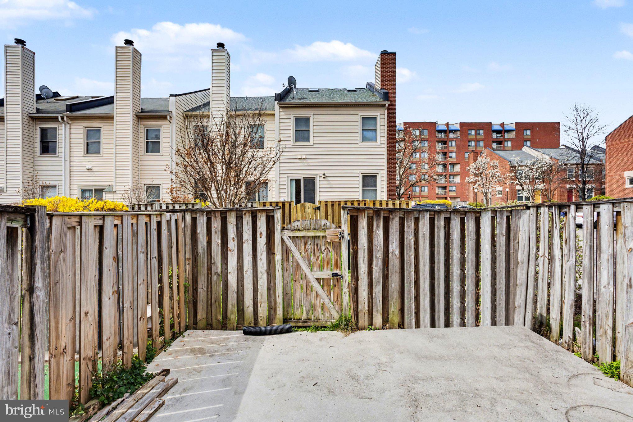 216 Scott Street Baltimore, MD 21230 - Photo 26 of 27 a view of a house with wooden fence