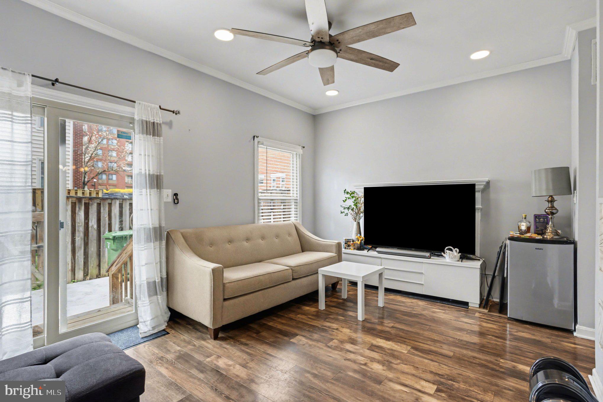 216 Scott Street Baltimore, MD 21230 - Photo 3 of 27 a living room with furniture and a flat screen tv