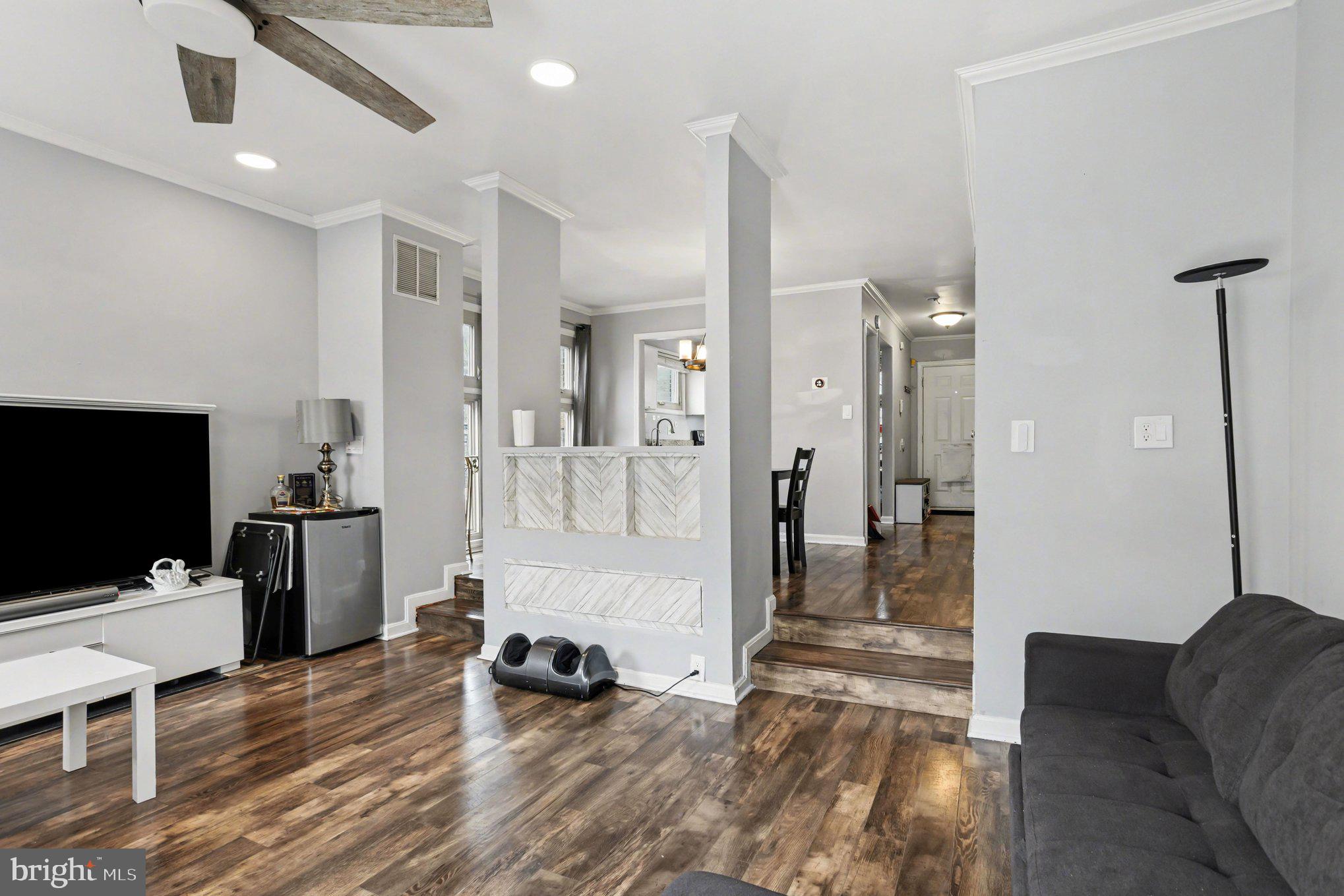 216 Scott Street Baltimore, MD 21230 - Photo 4 of 27 a living room with furniture and a flat screen tv