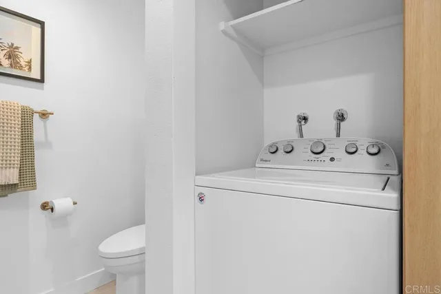 a view of bathroom with a toilet and a sink