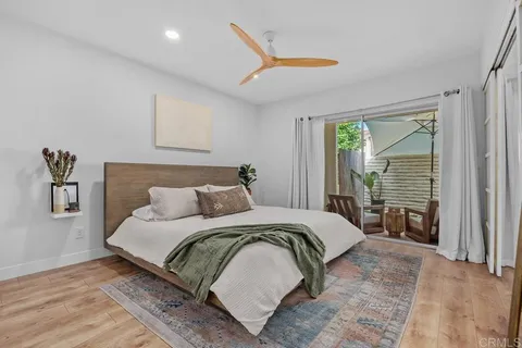 a bedroom with a large bed and a large window