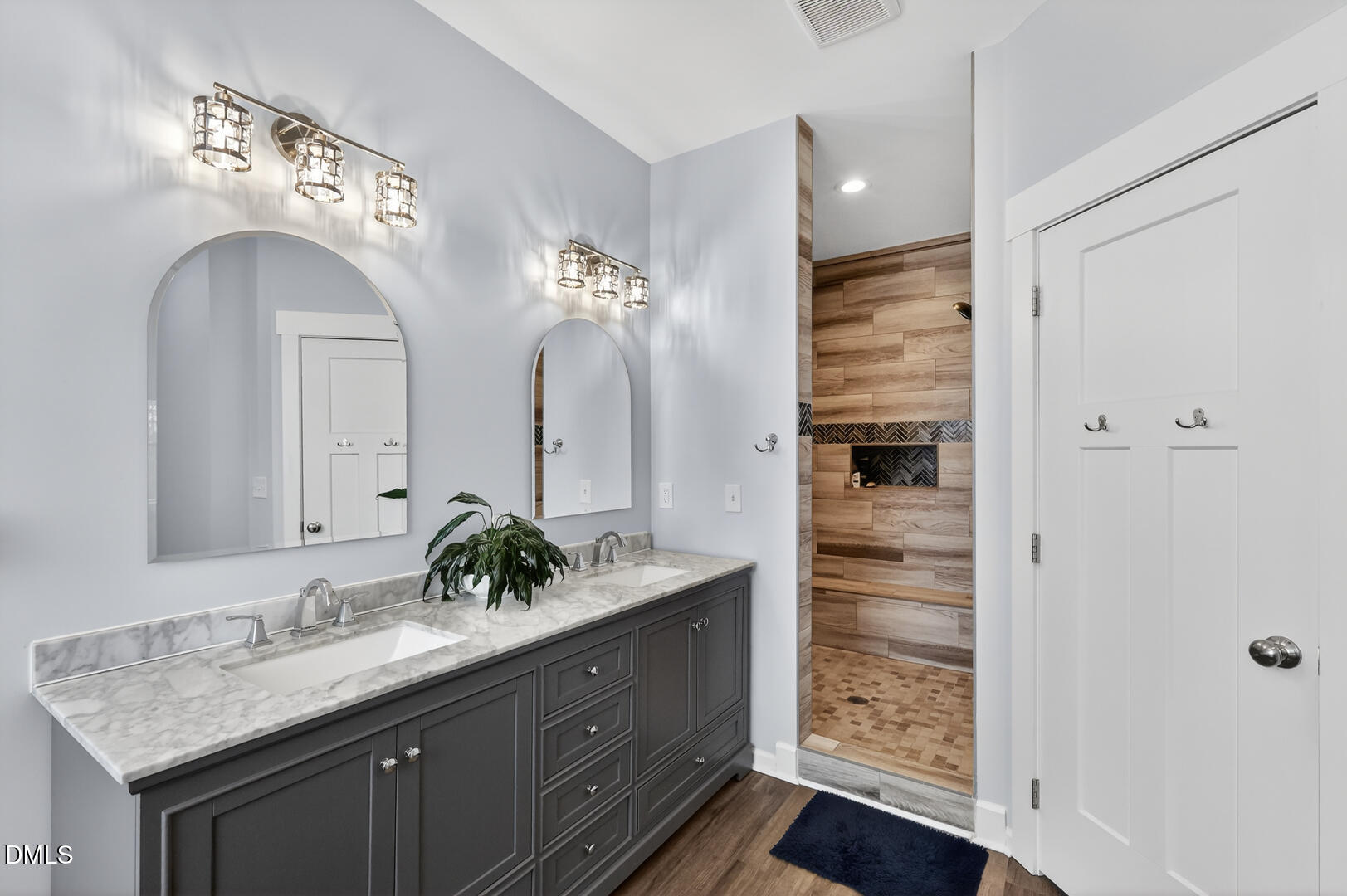 540 Pine Ridge Road Zebulon, NC 27597 - Photo 36 of 96 a bathroom with a double vanity sink and a mirror