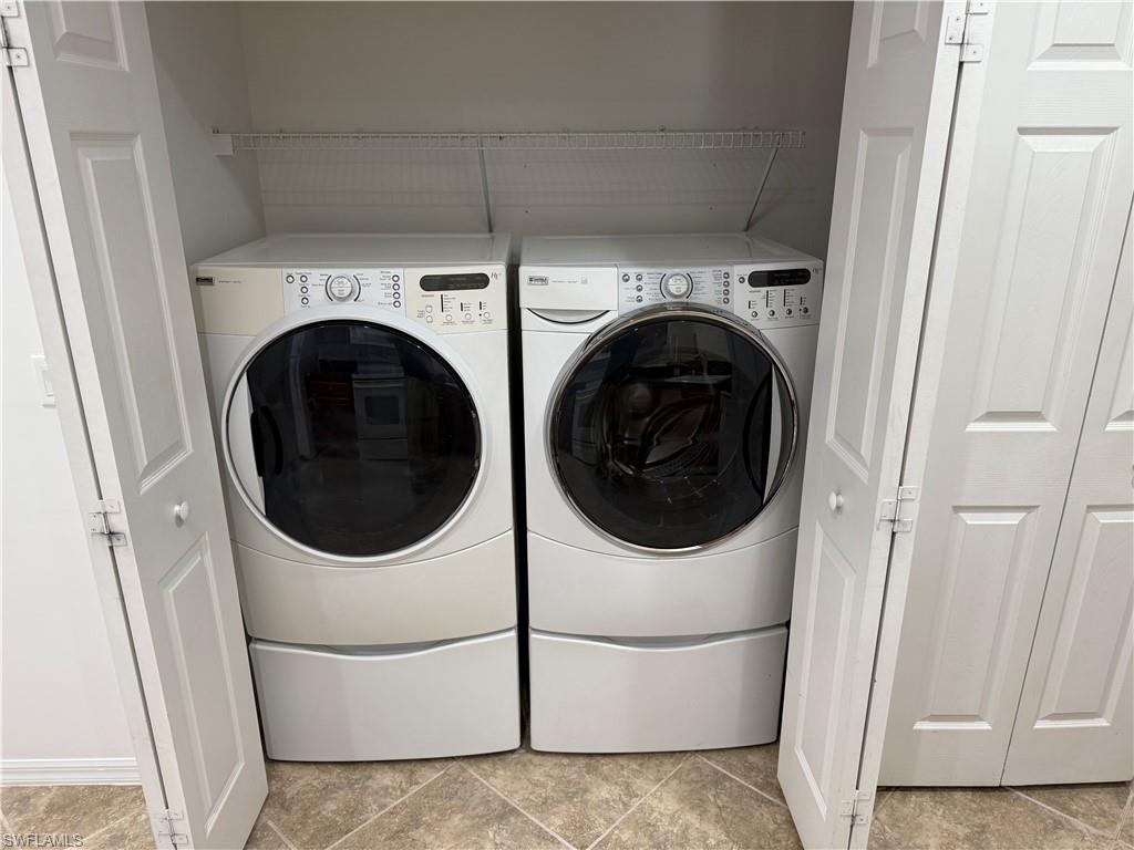 1345 Henley Street, Unit 705 Naples, FL 34105 - Photo 12 of 16 a utility room with dryer and washer