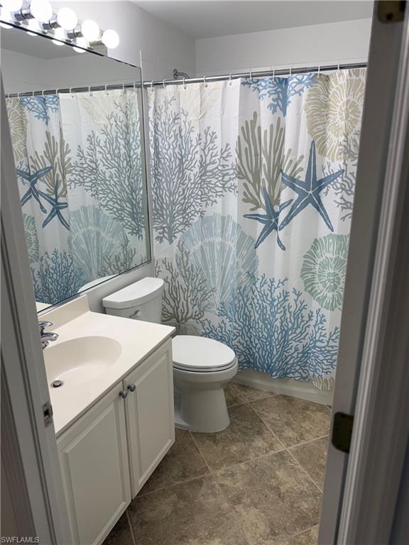 1345 Henley Street, Unit 705 Naples, FL 34105 - Photo 12 of 15 a bathroom with a sink and a mirror