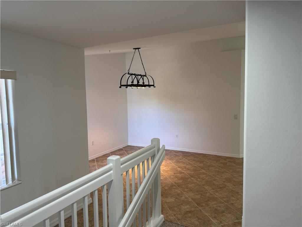 1345 Henley Street, Unit 705 Naples, FL 34105 - Photo 14 of 15 a view of a hallway with a window