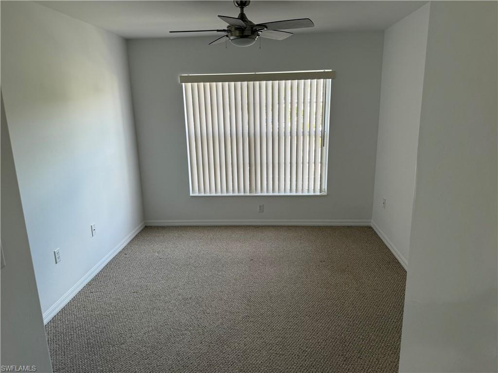 1345 Henley Street, Unit 705 Naples, FL 34105 - Photo 15 of 15 an empty room with a window