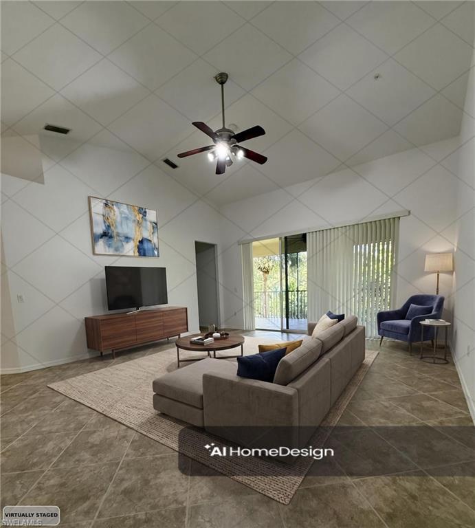 1345 Henley Street, Unit 705 Naples, FL 34105 - Photo 3 of 26 a living room with furniture and a large window