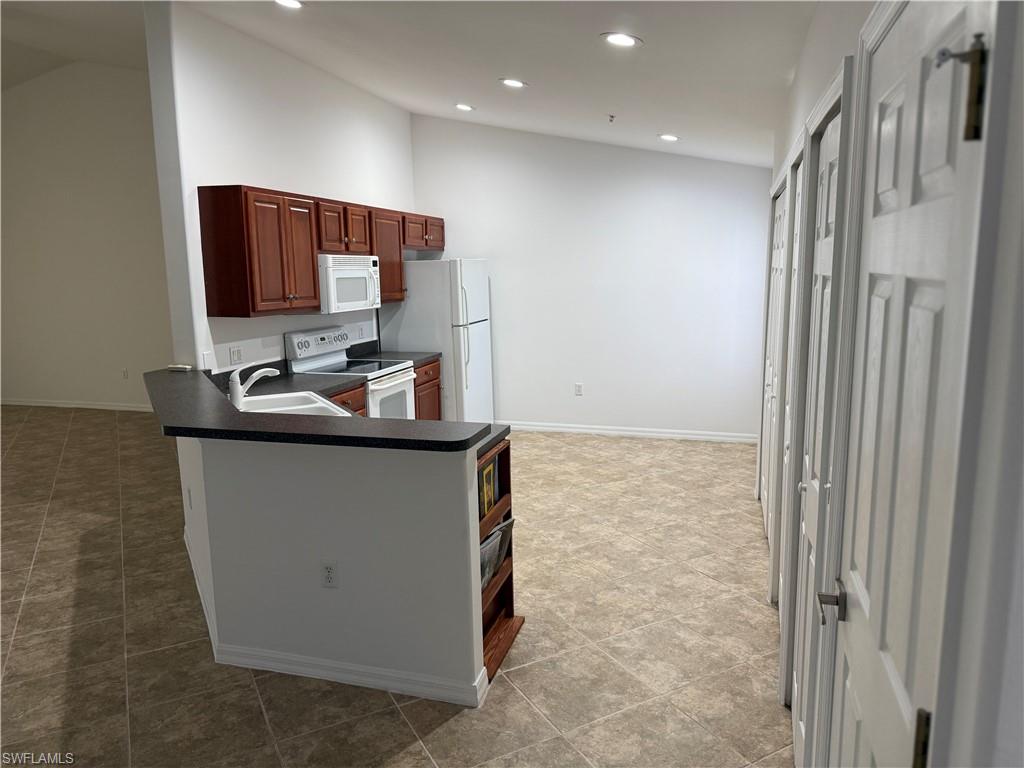 1345 Henley Street, Unit 705 Naples, FL 34105 - Photo 7 of 16 a bathroom with a sink and a mirror