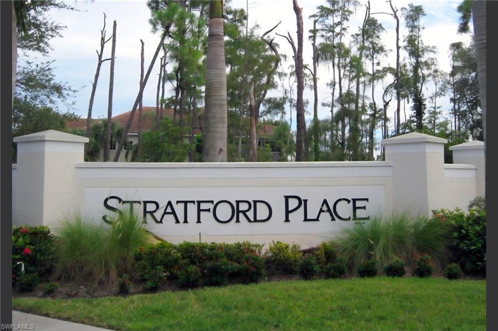 1345 Henley Street, Unit 705 Naples, FL 34105 - Photo 7 of 26 a sign of golf club on a wall under a tree
