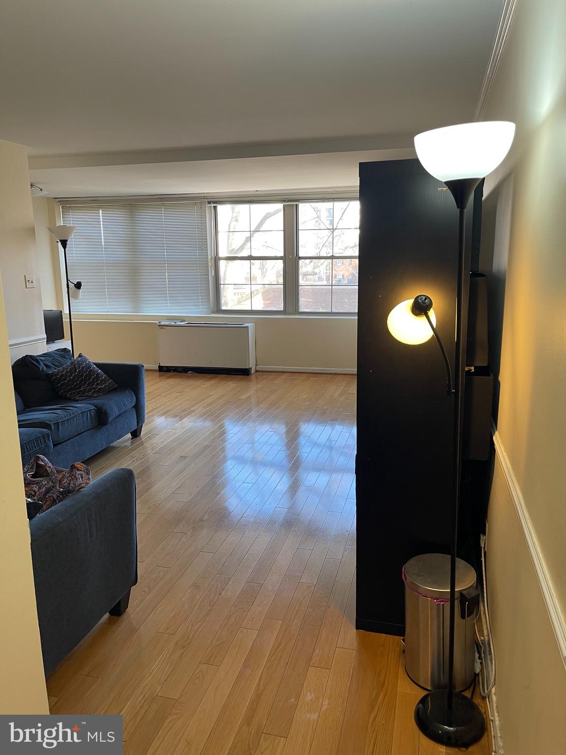 940 25th Street Northwest, Unit 317S Washington, DC 20037 - Photo 5 of 22 a view of a livingroom with furniture and a window