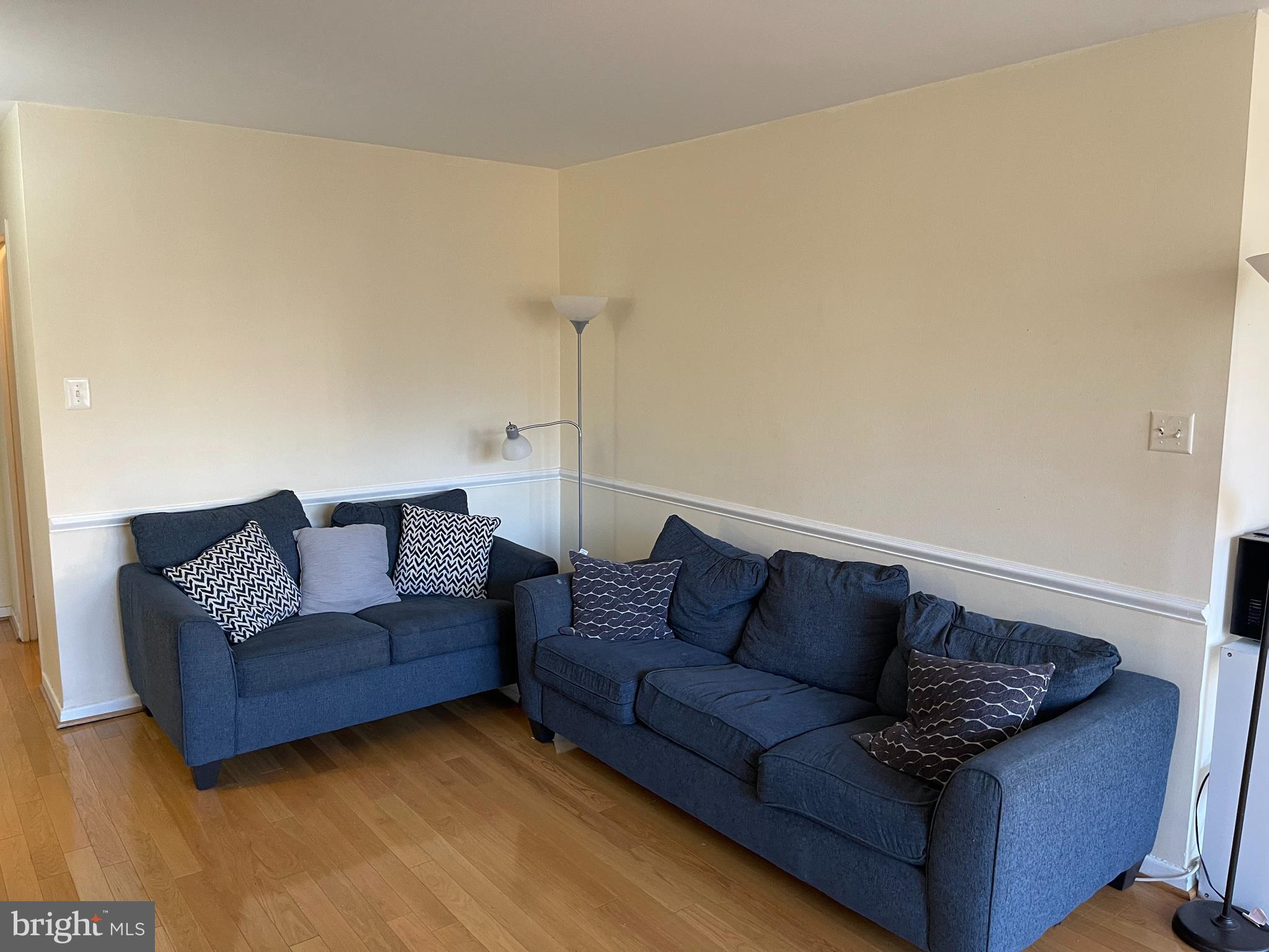940 25th Street Northwest, Unit 317S Washington, DC 20037 - Photo 7 of 22 a living room with furniture and a couch