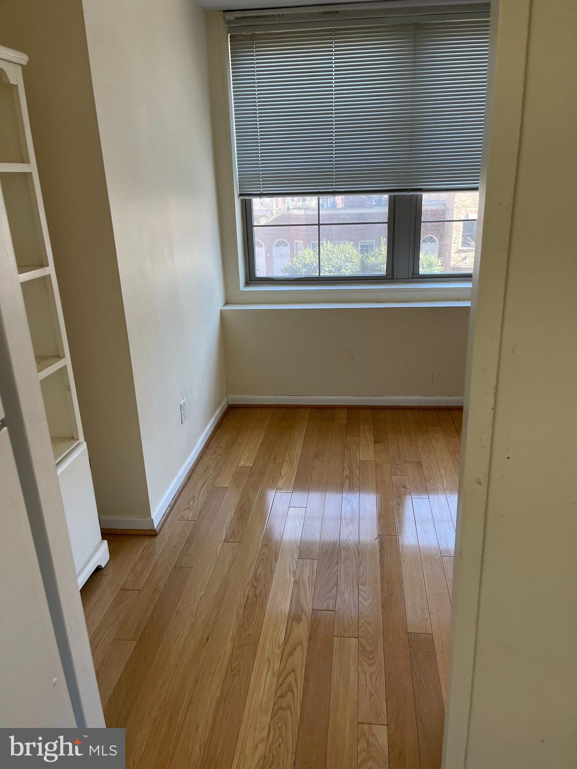 940 25th Street Northwest, Unit 317S Washington, DC 20037 - Photo 10 of 22 a view of a room with wooden floor and a window