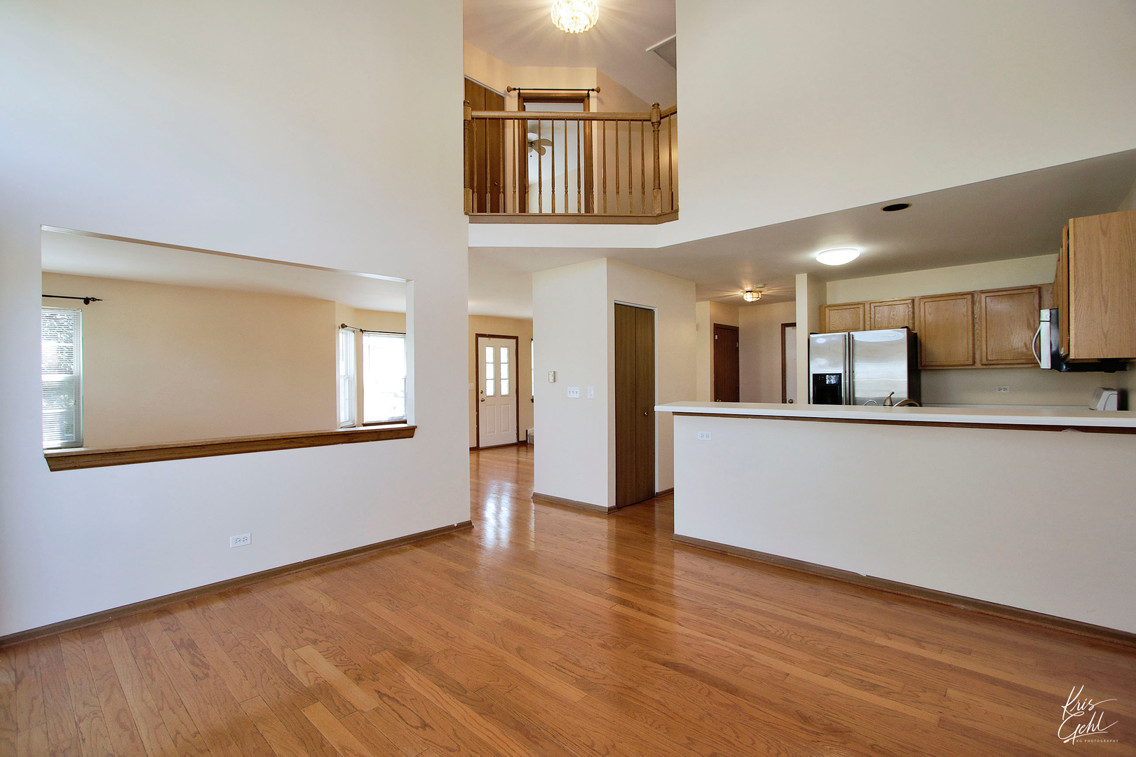 571 Willow Way Lindenhurst, IL 60046 - Photo 4 of 22 a view of a kitchen with kitchen island wooden floor and electronic appliances