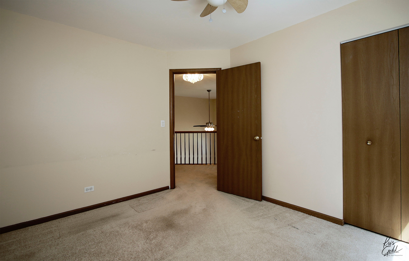 571 Willow Way Lindenhurst, IL 60046 - Photo 10 of 22 an empty room with closet and wooden door