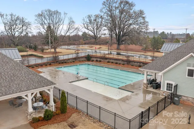 a view of a backyard with sitting area