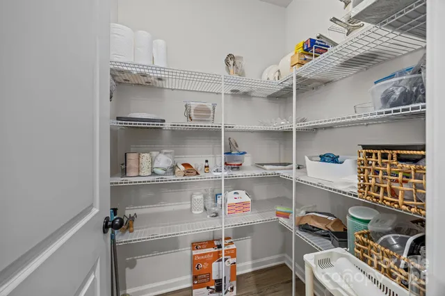 a shelf with books and knick knacks on it