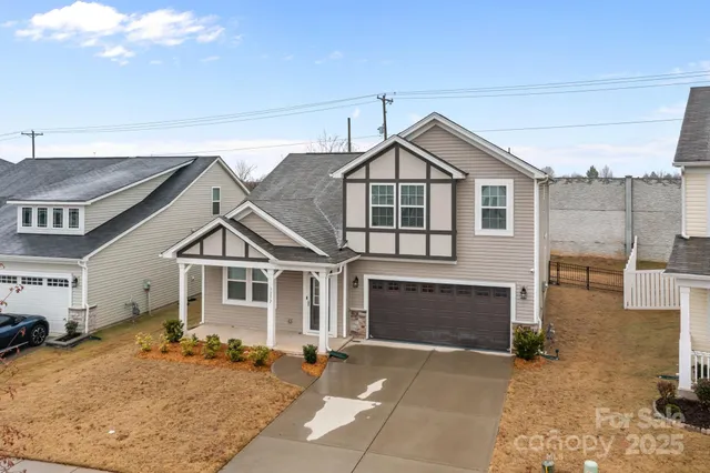 a front view of a house with a garage