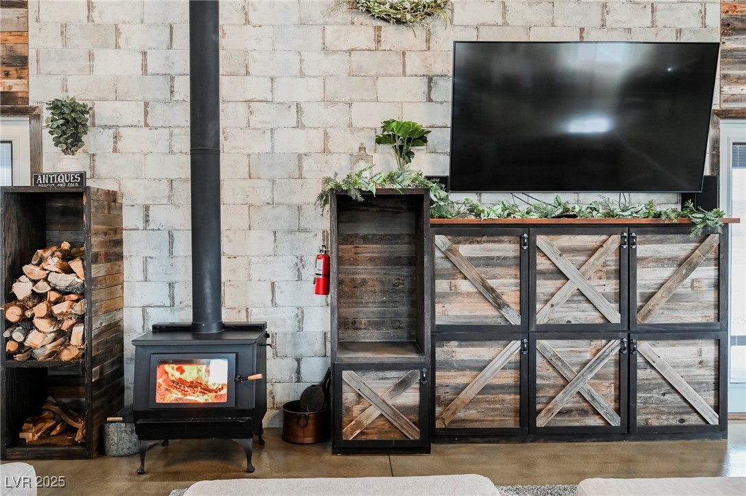 6510 Sunset Drive Caliente, NV 89008 - Photo 27 of 84 Living room featuring finished concrete flooring and a wood stove