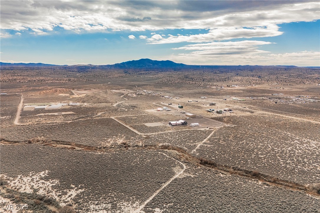 6510 Sunset Drive Caliente, NV 89008 - Photo 42 of 84 Aerial view of sparsely populated area featuring a desert landscape and mountains