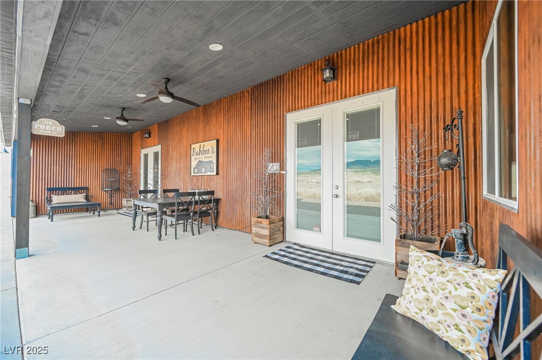 6510 Sunset Drive Caliente, NV 89008 - Photo 44 of 84 Entrance to property with french doors, outdoor dining area, a patio, and ceiling fan