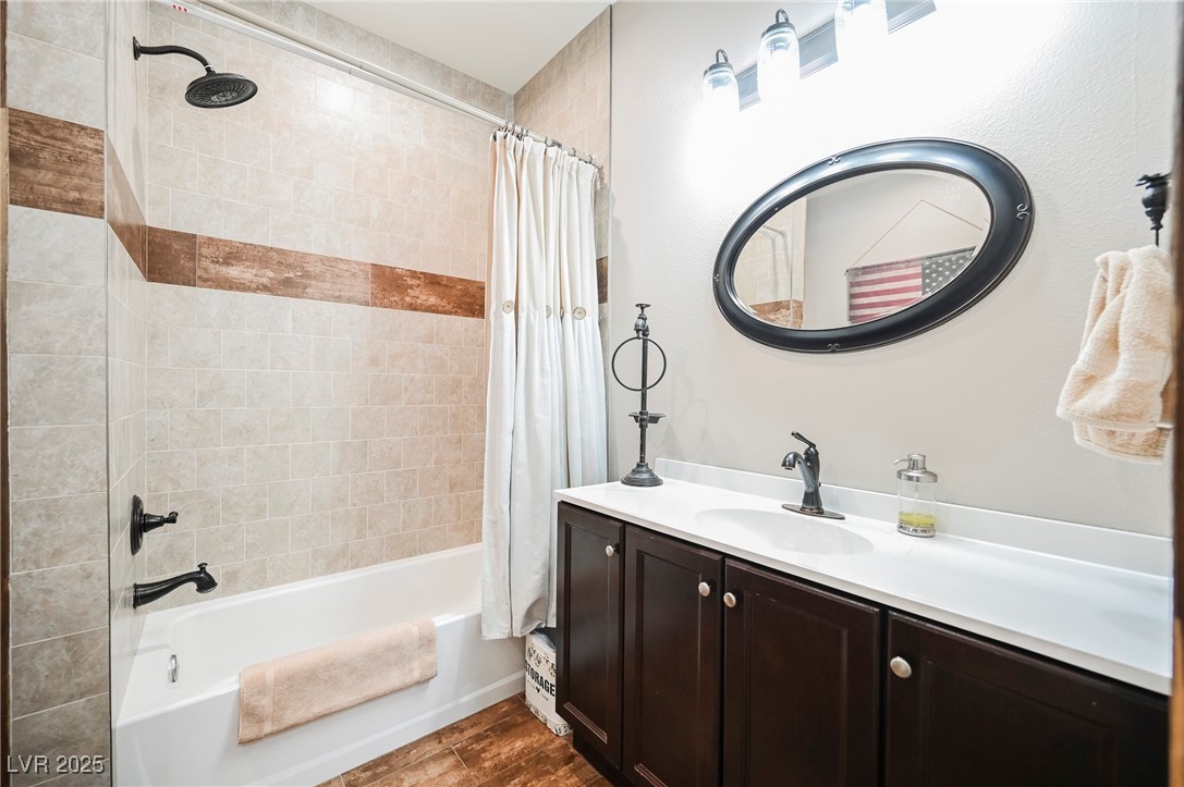 6510 Sunset Drive Caliente, NV 89008 - Photo 68 of 84 Full bath featuring shower / bathtub combination with curtain, vanity, and wood finished floors