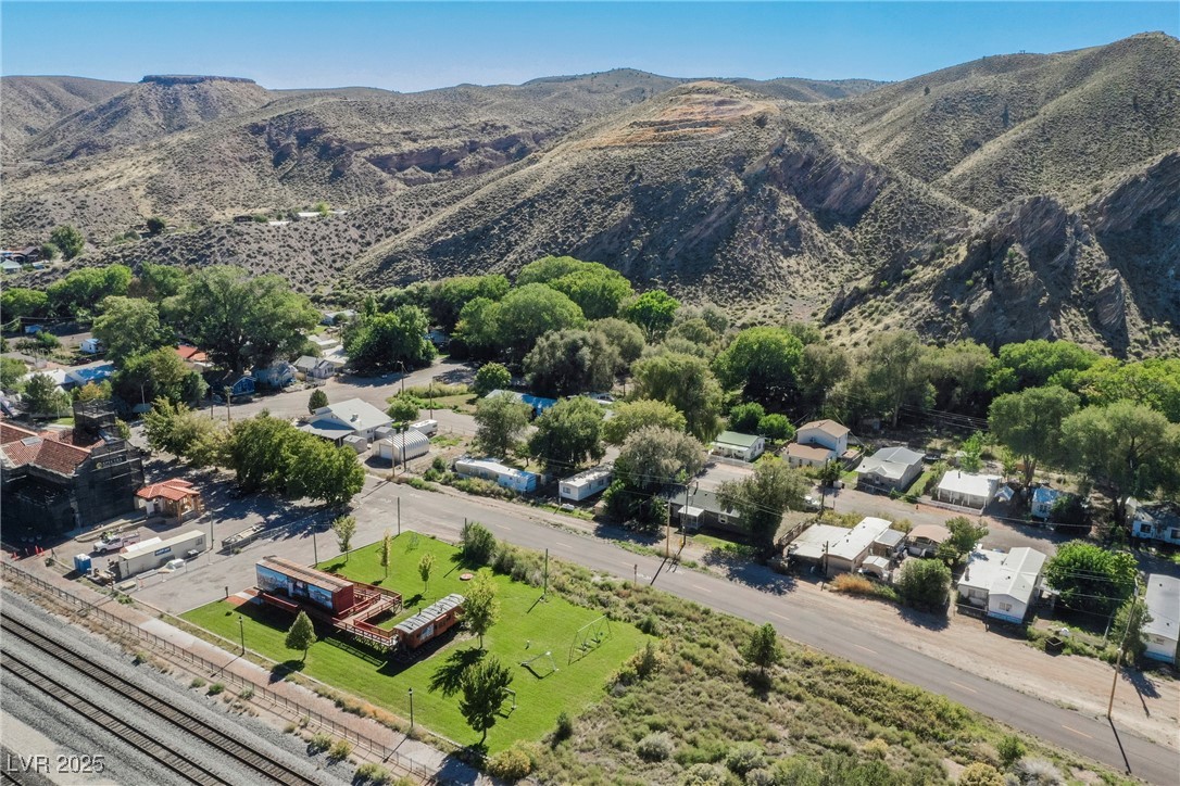 6510 Sunset Drive Caliente, NV 89008 - Photo 80 of 84 Aerial perspective of suburban area featuring a mountainous background