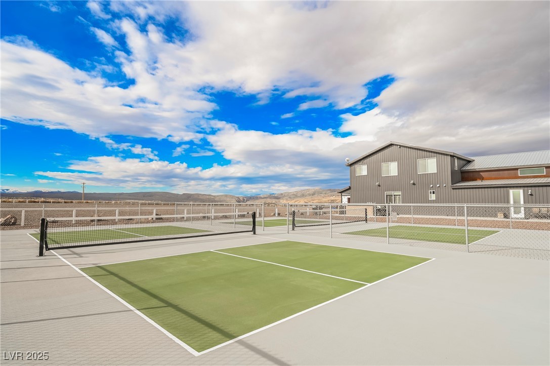 6510 Sunset Drive Caliente, NV 89008 - Photo 8 of 84 View of tennis court featuring a mountain view