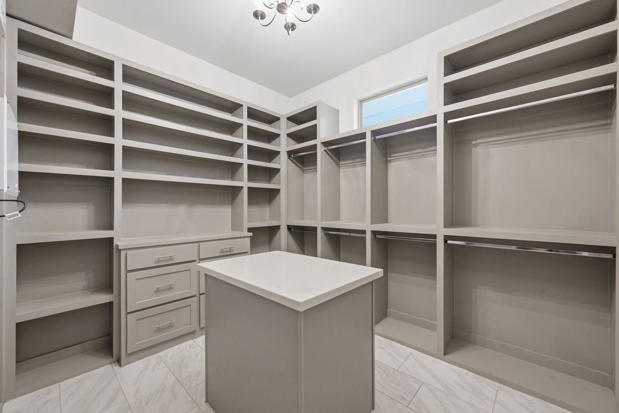 1906 West 25th Street Houston, TX 77008 - Photo 22 of 47 Primary closet, complete with custom built ins and island