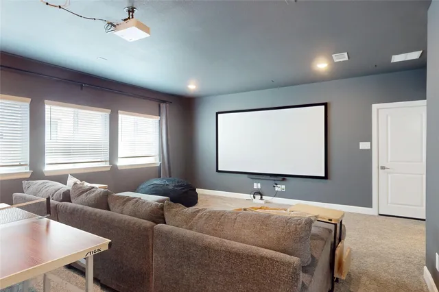 a living room with furniture window and a projector