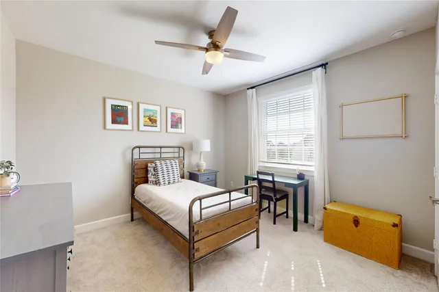 a bedroom with a bed and a table