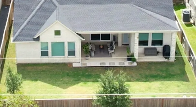 a view of house with swimming pool outdoor seating
